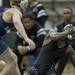 Pioneer wrestler Billy Cobb Gulley reacts to getting hit in the face on Wednesday, Feb. 6. Daniel Brenner I AnnArbor.com